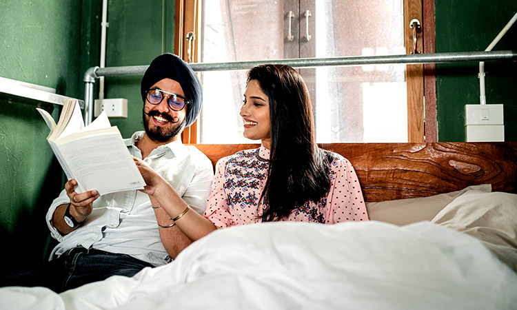 Lovers looking at a bed book